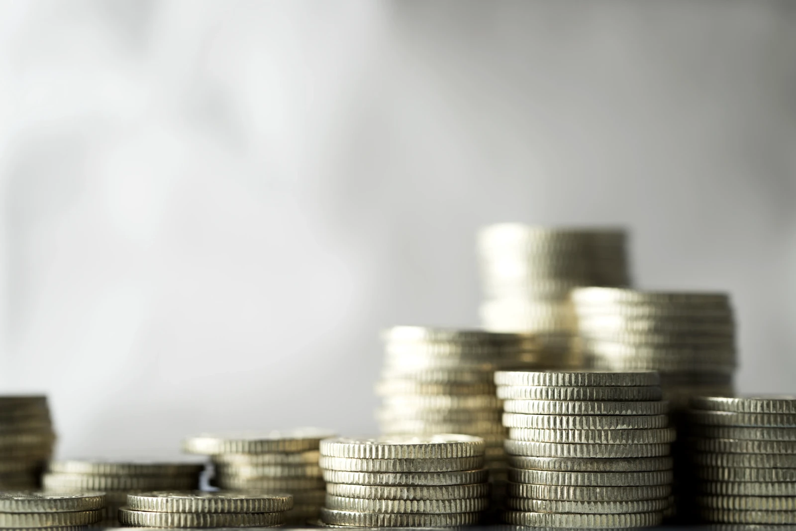Stacks of coins — Audiimax keeps music licensing affordable